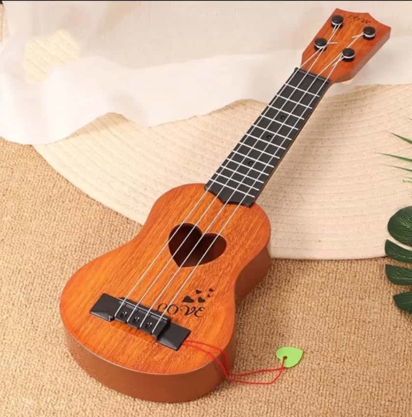 Four-string musical instrument ukulele with heart-shaped sound hole - Tenderyard