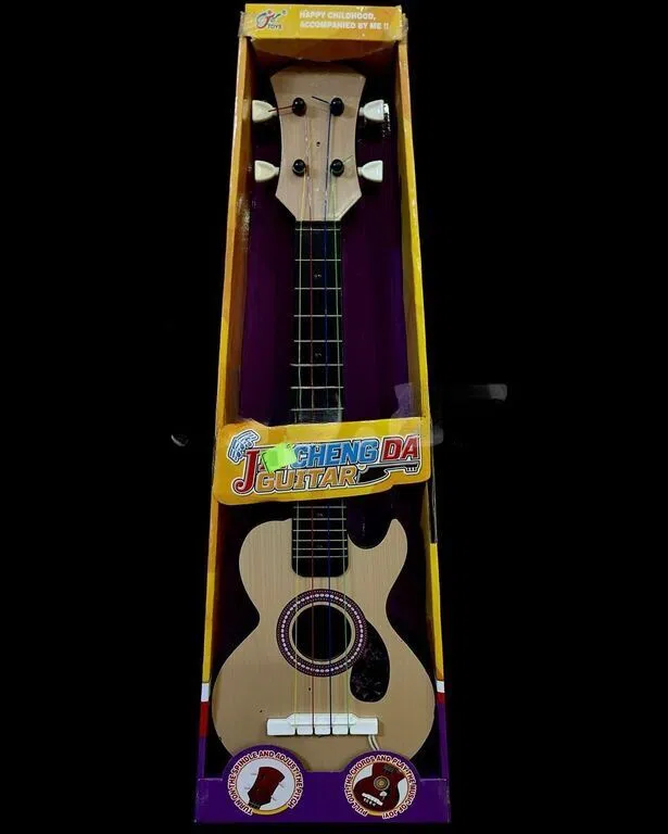 Toy guitar - Tenderyard